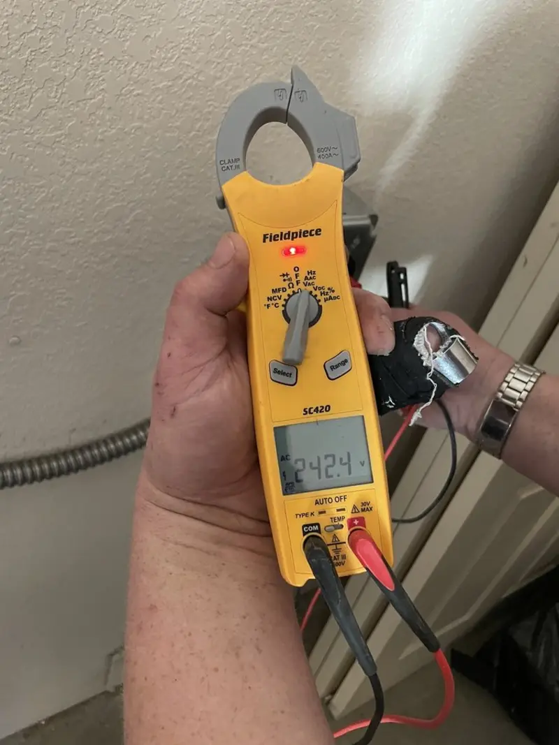 Voltage testing with clamp meter during Outlet Installation in Hanahan